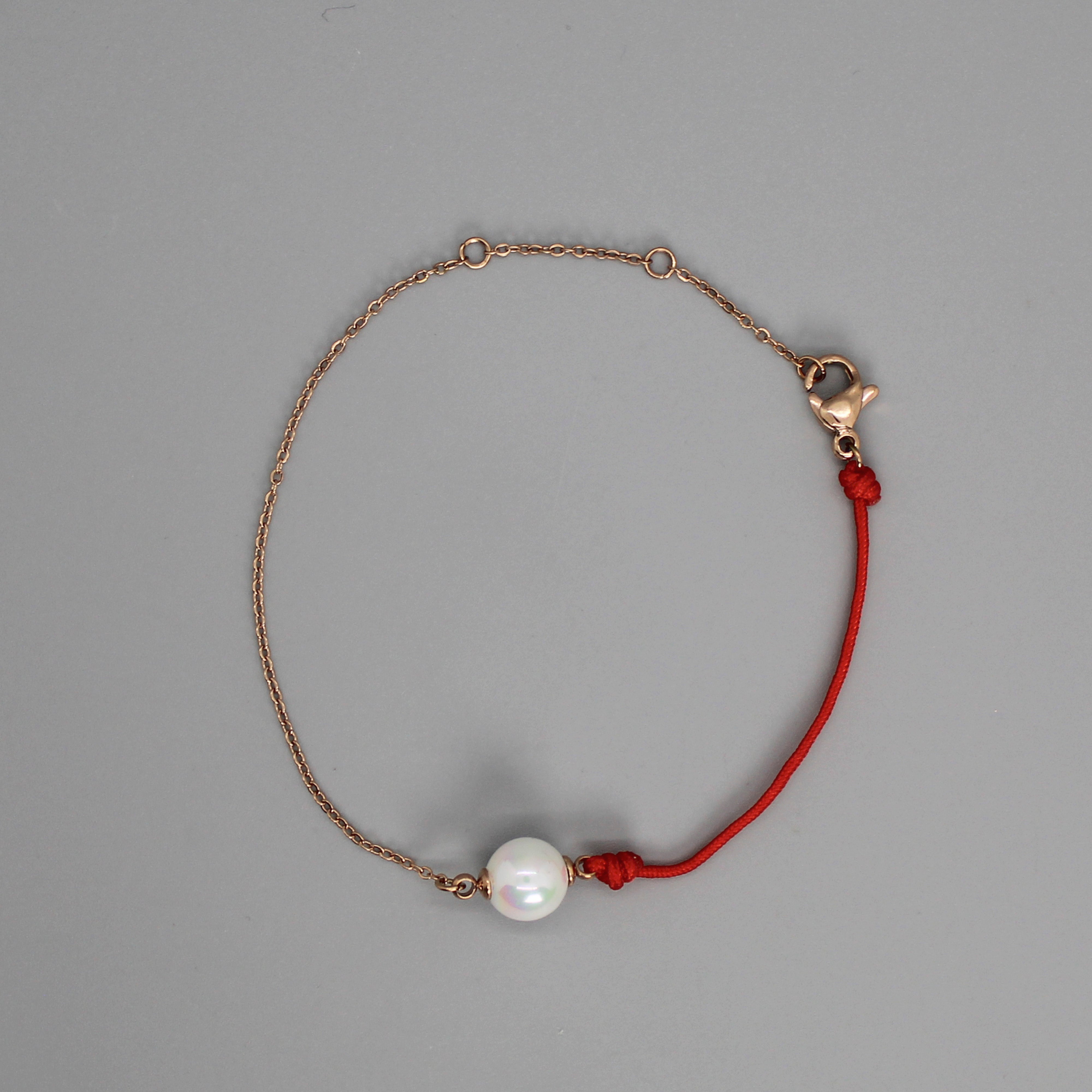 Brazalete de cadena y cordón con perla