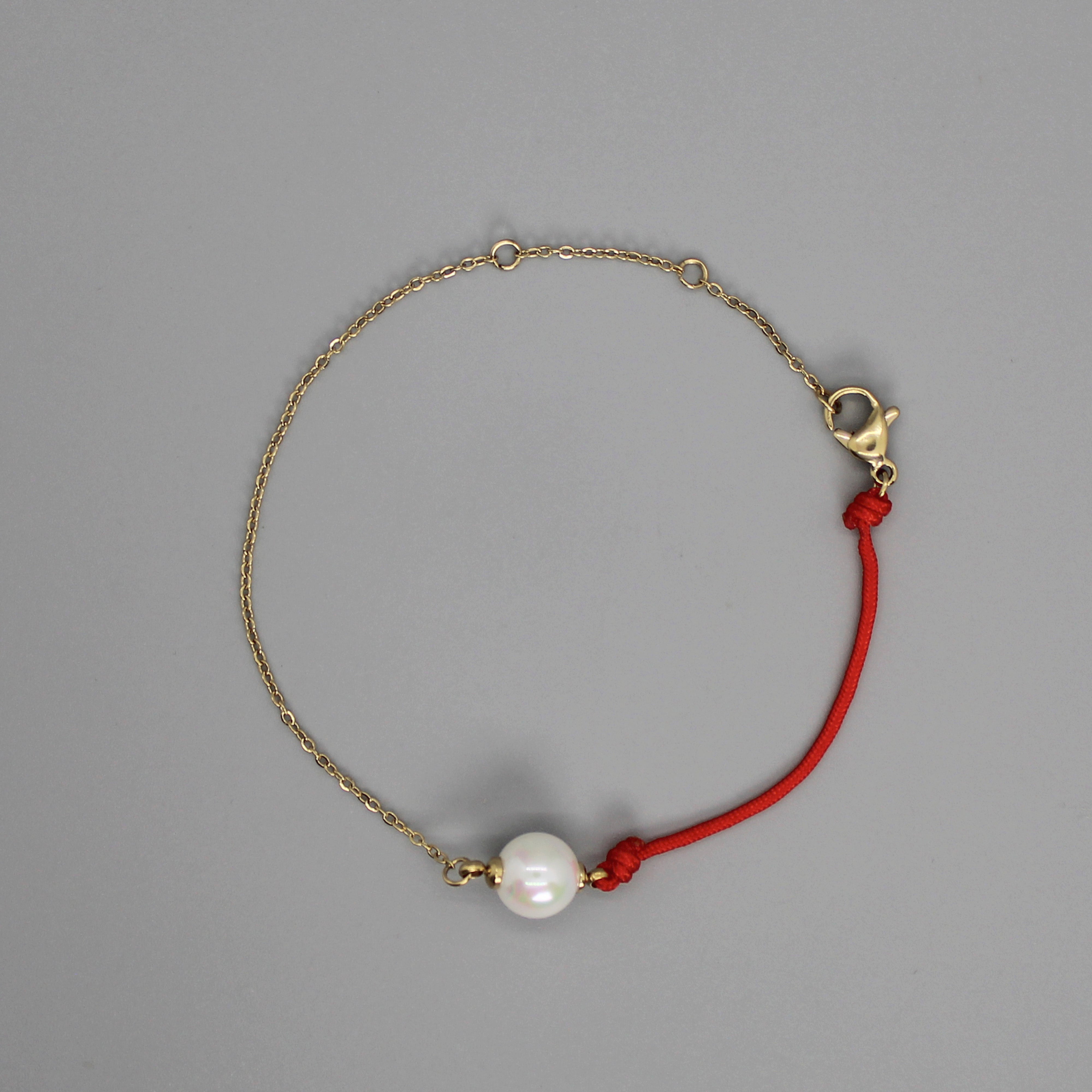 Brazalete de cadena y cordón con perla