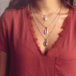 Cadena triple con caracoles