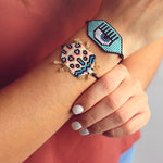 Brazalete de cordón y ojo tejido